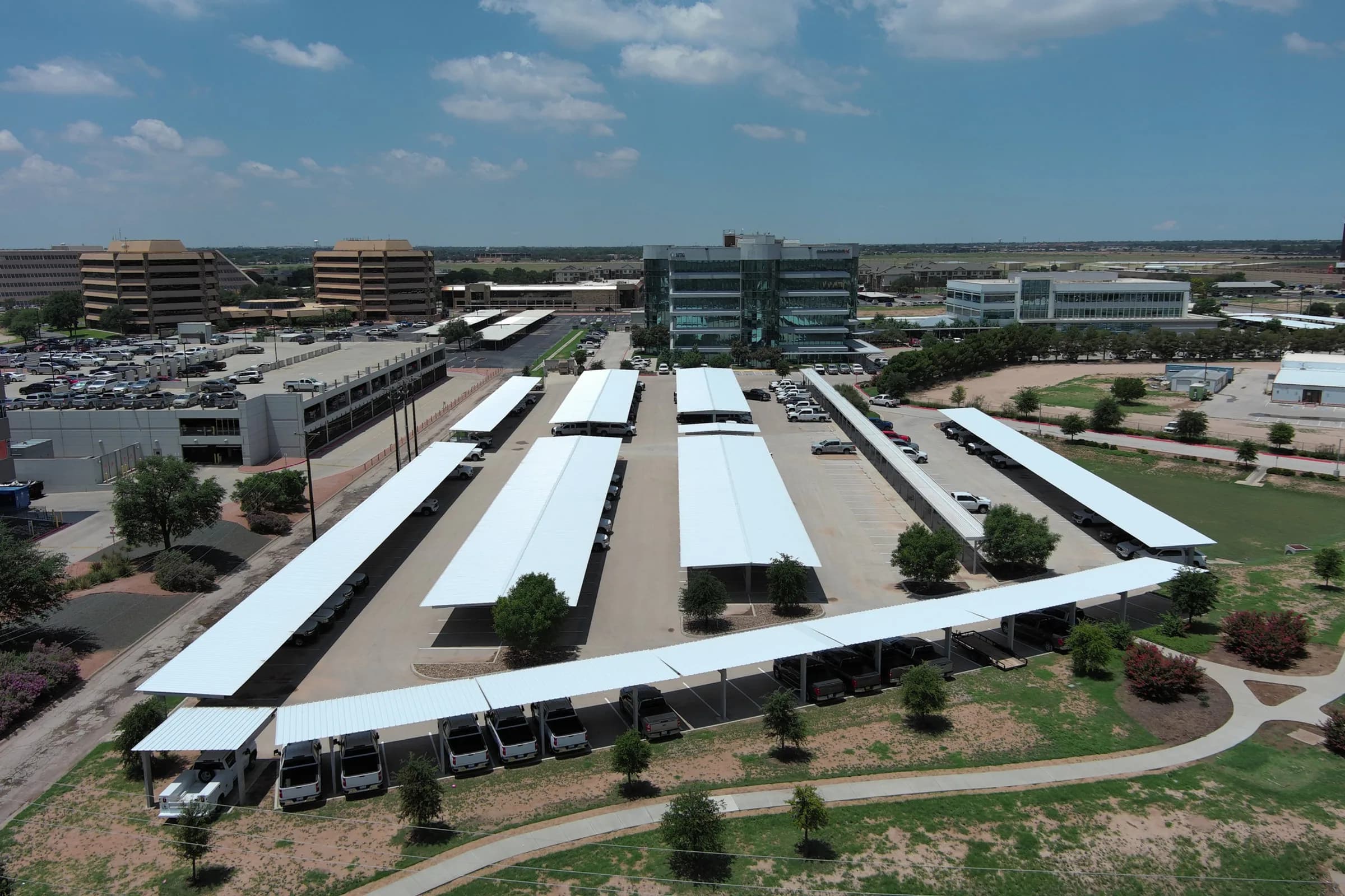 Steel carport canopy over a parking lot